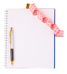 Planning of a diet. Notebook measuring tape and pencil