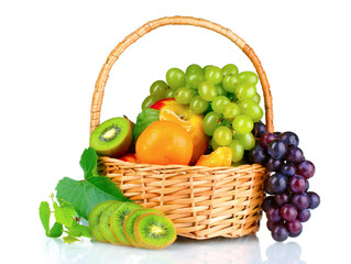 Ripe juicy fruits in  basket isolated on white