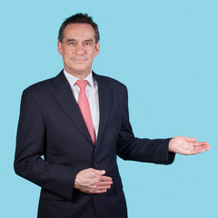 Smiling Business Man in Suit Indicating Copy Space
