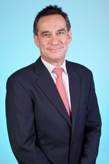 Handomse Smiling Business Man in Suit on Aqua Background