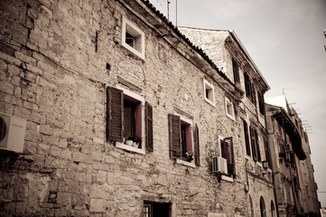 Fototapeta na wymiar Dark image of an old stone house in Croatia