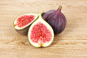 Ripe figs on wooden background