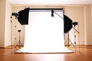 Empty photo studio with  lighting equipment