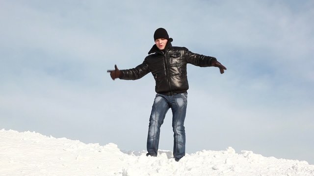 The man is dancing on the slope and then falls