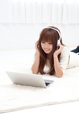 pretty asian woman using laptop