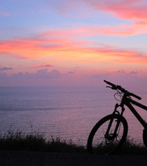 Fototapeta premium Sunset By The Sea After A Bike Ride