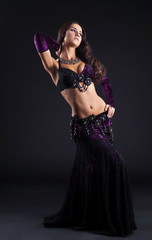 beauty girl in oriental purple arabic costume