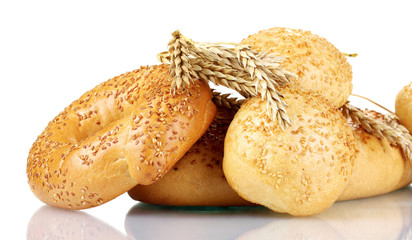 bread and buns with sesame seeds and spikelets isolated on white