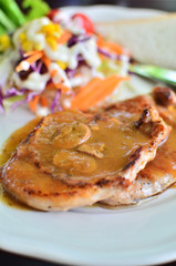 Grilled pork steak with mushroom sauce