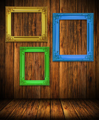 Old antique colorful frame on wood wall