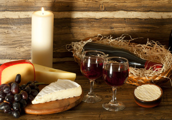 Red wine and cheese on a cheeseboard