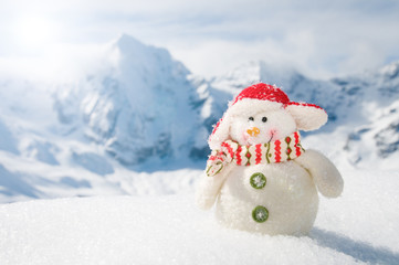 Merry Christmas - snowman and winter mountains
