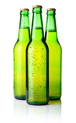 Three green bottles of beer isolated on white