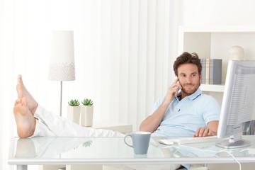 Cool man with feet up on desk