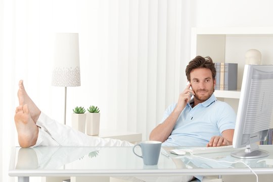 Cool Man With Feet Up On Desk