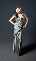 young woman in grey evening dress, professional make-up.