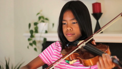 Asian Girl Practicing Violin