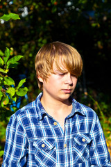 portrait of angry boy in leaves