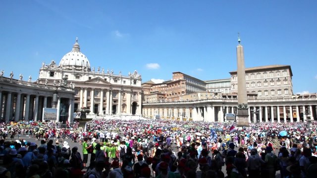Crowd of tourist gathered on square near Saint Peters Cathedral