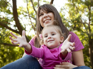 Little girl and mother in the park