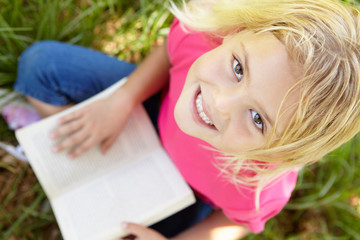 Portrait of happy girl with book