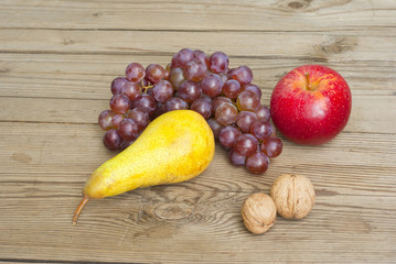 apples grapes and pears, wooden table