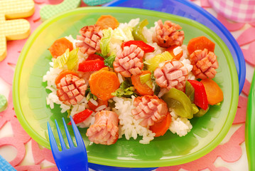 dinner with sausage,vegetables and rice for child