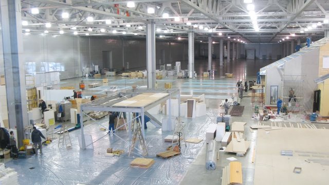 Workers prepare stands