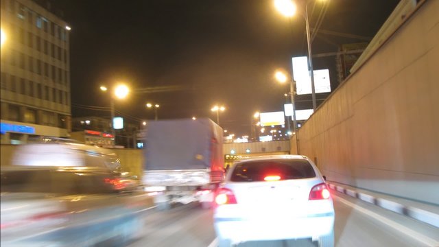 Drive through Moscow at night, view from car