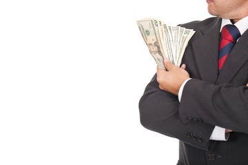 businessman holding a lot of dollar bills