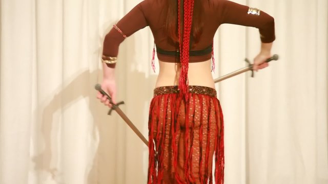 moving torso of woman with knife dancing belly dance