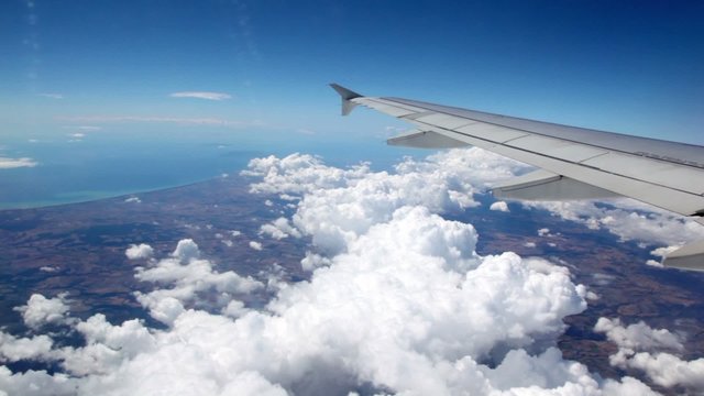 Clouds under aircraft wing