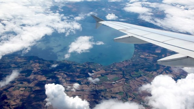 Aircraft fly up, ground under wing of an airplane change to sky