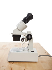 stereo microscope on wooden desk