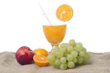 Glass of orange juice isolated tropical fruits