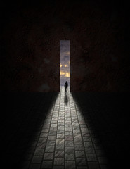 Man before large opening