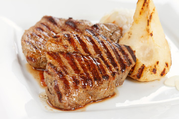 Grilled pork steak with pear