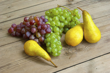 grapes and pears, wooden table