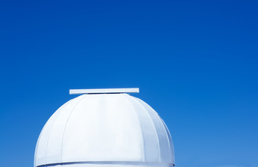 astronomical observatory dome in blue sky