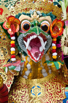 Balinese mask garuda covered in gold and colour