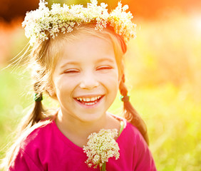 little girl in wreath of flowers