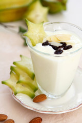 Healthy breakfast [yogurt with almond and starfruit ]