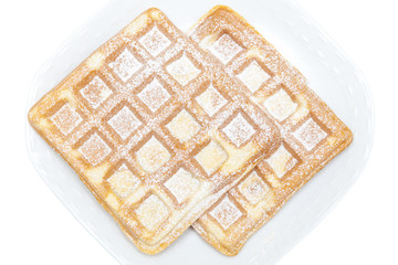 Waffles on white plate isolated on white background