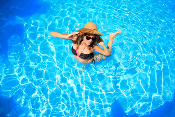 woman in a swimming pool in Greece