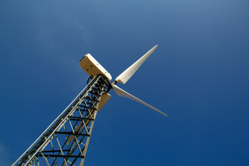 The wind generator against the blue sky