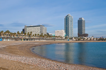 Naklejka premium Barceloneta Beach near Port Olimpic area in Barcelona, Spain