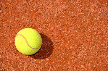 Tennis ball on a tennis clay court