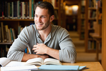 Smiling male student working