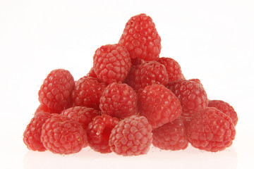 Tasty rasberries in a heap on a white background.