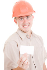 Businessman in helmet with visit card in his hand.